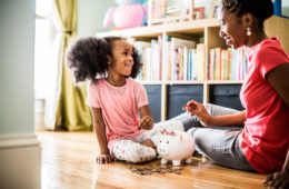mother-and-daughter-putting-money-in-piggybank-6389327 mother-and-daughter-putting-money-in-piggybank-6389327